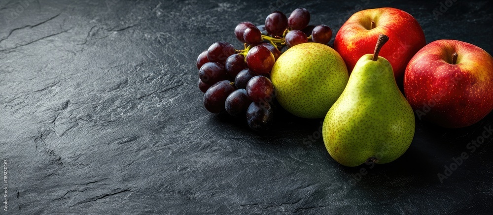 Poster apple pear and grapes against a dark stone background highlighting vegetarian health with fruits and