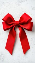 A photostock of a classic red ribbon tied in a bow, placed on a simple white background for a clean holiday design, High Quality