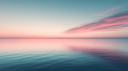 Obraz premium Serene Pink Sunset Reflected in Calm Ocean Waters
