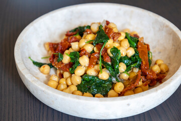 Healthy Salad with Chickpeas, Sun-Dried Tomatoes, and Spinach Close-Up
