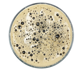 Glass of dark stout beer with foam, isolated on white, top view, clipping path