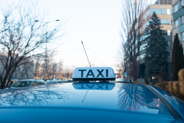  Checker taxi lighted rooftop car on a blurred background. High quality photo