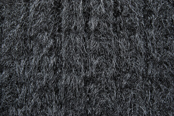 Black chunky fluffy wool jersey fabric texture as background