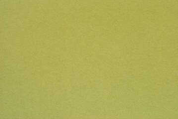A sheet of olive color cardboard texture as background
