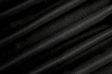 Black furniture fabric gunny background crease lines. Top view.