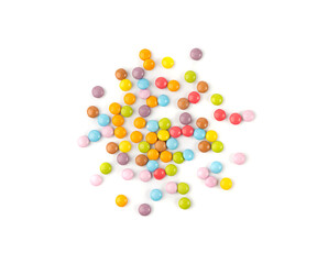 Scattered small candies isolated. Colorful dragees, multicolored glazed chocolate buttons