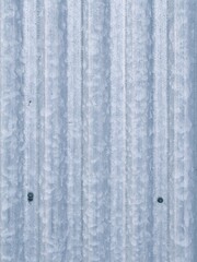 Corrugated iron wall with two bolts