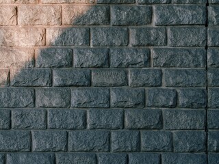 Old, calm, partially lit stone wall