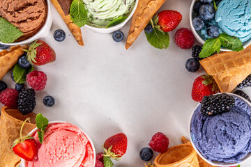 Colorful bright ice cream on bowls, with waffle cones