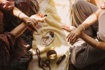 Close up of female mentor and student before Mindful meditation and yoga in the gazebo....