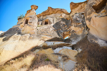 Goreme, Turkey. - July 27, 2024: Cavushin Cave City. Buildings in tuff rocks. Dwellings and temples of ancient people. Archaeology and history.