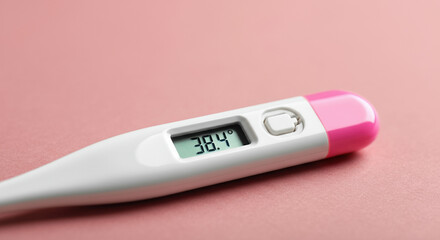 Digital thermometer displaying a temperature of 38.4 degrees Celsius