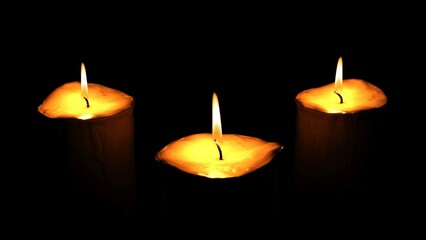 Set of flames of burning candles isolated on a black background. Closeup flame burning in candle isolated on dark background. Candle fire flame	
