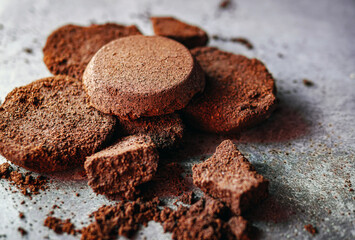 Close-up of coffee grounds from espresso machine. coffee ground on gray background