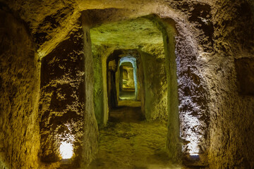 Ancient passage in underground city of Ouyi in Nushabad, Iran (near Kashan). Separate rooms are...