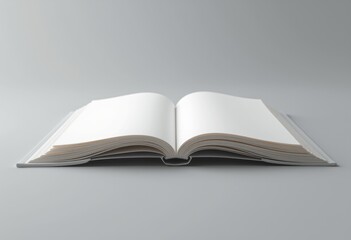 Open blank book on a gray background.