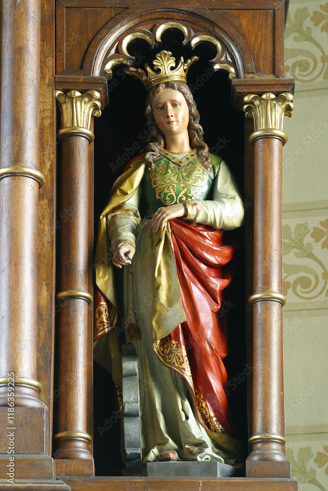 Wall mural Saint Catherine of Alexandria, statue on the altar of Saint Barbara in the parish church of the Assumption of the Virgin Mary in Resnik, Croatia