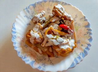 Cauliflower dish. Potato, pepper, cauliflower fries.