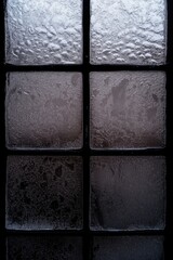 Frosted glass blocks with textured surface in grayscale pattern