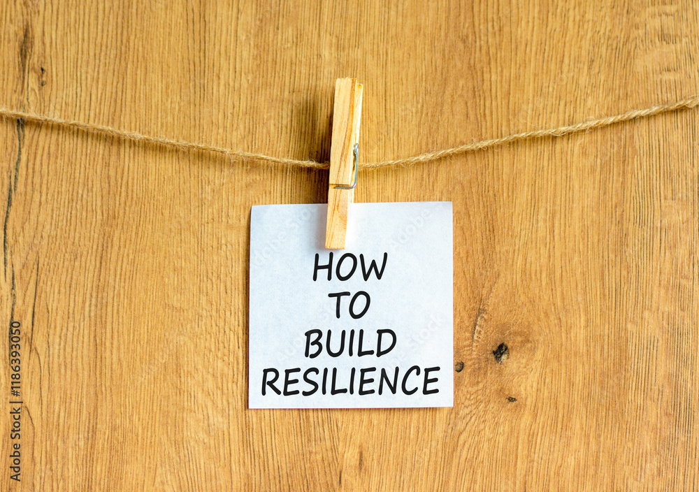 Aufkleber how to build resilience symbol. concept words how to build resilience on beautiful white paper on cl