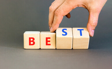 Motivational and inspirational be best symbol. Concept words Be best on beautiful wooden block. Beautiful grey background Businessman hand. Business motivational be best concept. Copy space.