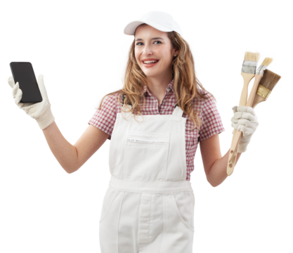 Happy woman in painters overalls showing phone for online shopping of colors and products to painting home walls and renovate the house, holding paint brushes and browsing an online paint store
