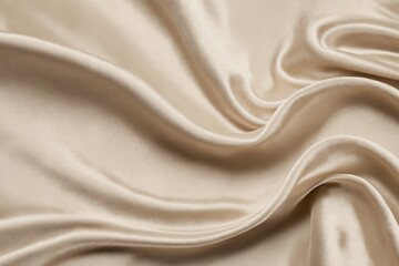Fototapeta premium Beige silk fabric showing folds