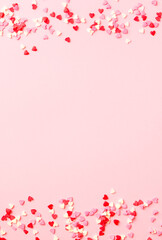 Sugar hearts frame on pink background. Romantic, St Valentines day concept. Top view. Copy space.