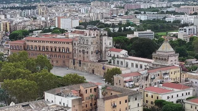 Aerial view of Palazzo dei Normanni with its historic architecture, surrounded by the vibrant city of Palermo, Italy.