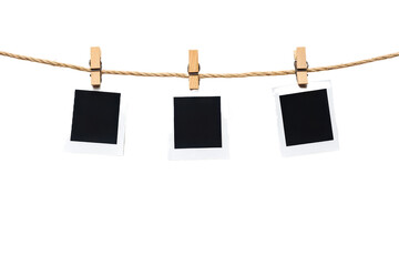 Three Polaroid photo frames hanging on a rope, with . Quality photography,  isolated on transparent png or white background