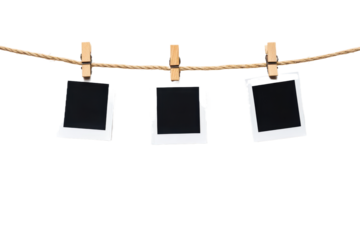 Three Polaroid photo frames hanging on a rope, with . Quality photography,  isolated on transparent png or white background