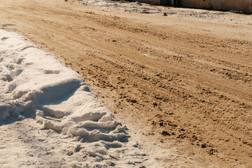 uncleaned roads after a winter snowfall in Kazakhstan. highway covered with sticky snow in Shymkent