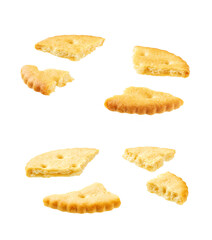Broken round crackers isolated on white background.