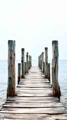 Fototapeta premium Solitary Wooden Pier Extending into Calm Ocean Waters