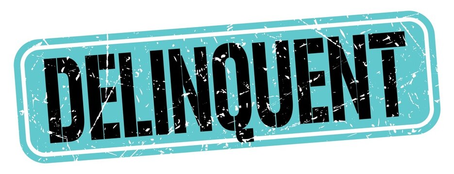 DELINQUENT text written on blue-black stamp sign.