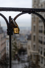 Love lock attached to a railing overlooking Paris. Symbol of love and commitment.