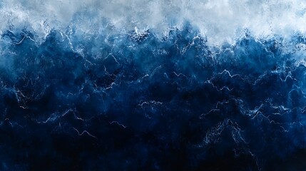 Aerial view of dark blue ocean waves.