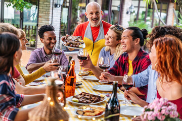 Group of people having bbq dinner party at garden restaurant - Food and beverage life style concept