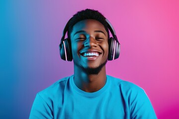 Young Man with Headphones Enjoying Music against Colorful Background