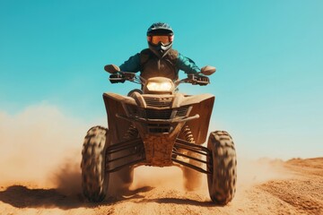 Obraz premium Adventurous Rider on All-Terrain Vehicle in Sandy Desert Landscape