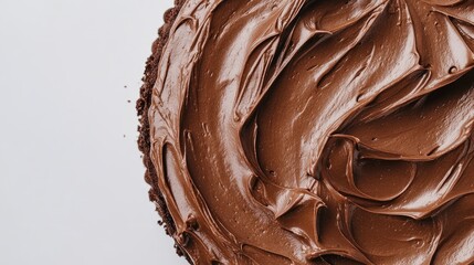 Delicious chocolate mousse cake with a smooth glossy finish on a clean white background perfect for desserts and pastries promotion