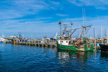 Fototapeta premium A view of boats moored on the dock in the harbor at Newport, USA in the fall
