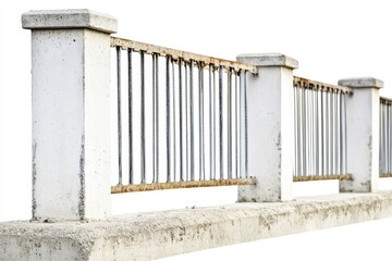 A person rides a skateboard on the top of a concrete wall, showcasing urban action and thrill-seeking activities