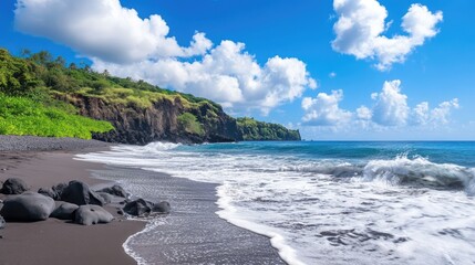 Obraz premium Stunning Sea Waves Rolling onto Black Sand Beach under a Bright Blue Sky with Fluffy Clouds in a Serene Coastal Landscape