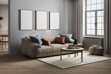 Modern living room with a beige plush sofa, decorative pillows, nesting coffee tables, and blank...