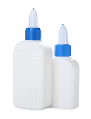 Bottles of glue with caps isolated on white