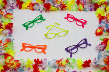 Plastic glasses highlighted, framed by colorful Hawaiian leis. White background. Perfect for...