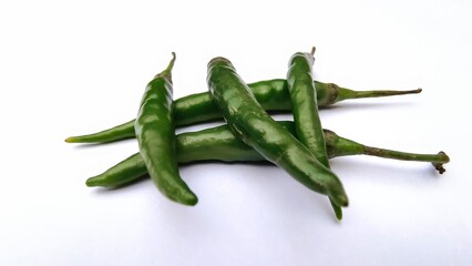 green chili peppers with white background