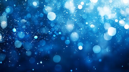 Abstract blue bokeh background with bright lights and sparkles.
