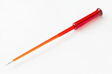 A single red pen sits on a white surface, ready for use